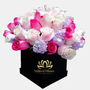 Box negro elegante con rosas en tonos pasteles y lilas para envío de regalo a domicilio en Guayaquil.