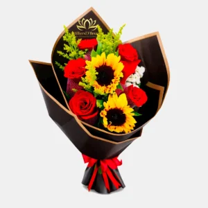 "Ramo de girasoles amarillos y rosas rojas Sun & Passion en envoltorio negro elegante con detalles dorados de Milliers D'fleurs."