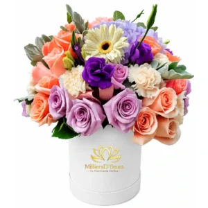 Box blanca elegante con arreglo floral en tonos pasteles y rosas para entrega a domicilio en Guayaquil con MilliersD'fleurs.