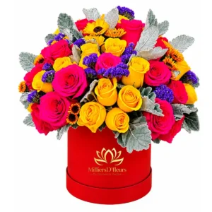 Box roja con vibrantes rosas fucsia y amarillas para entrega a domicilio en Guayaquil con MilliersD'fleurs.